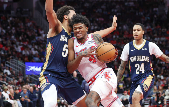 Rockets guard Jalen Green (4) drives with the ball as New Orleans Pelicans forward Jeremiah Robinson-Earl (50) defends during the fourth quarter at Toyota Center.